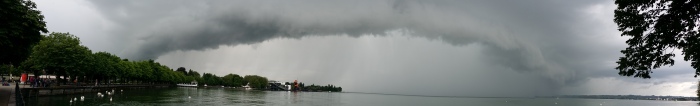 Thunderstorm wall cloud over Lake Constance, approaching the city of Bregenz